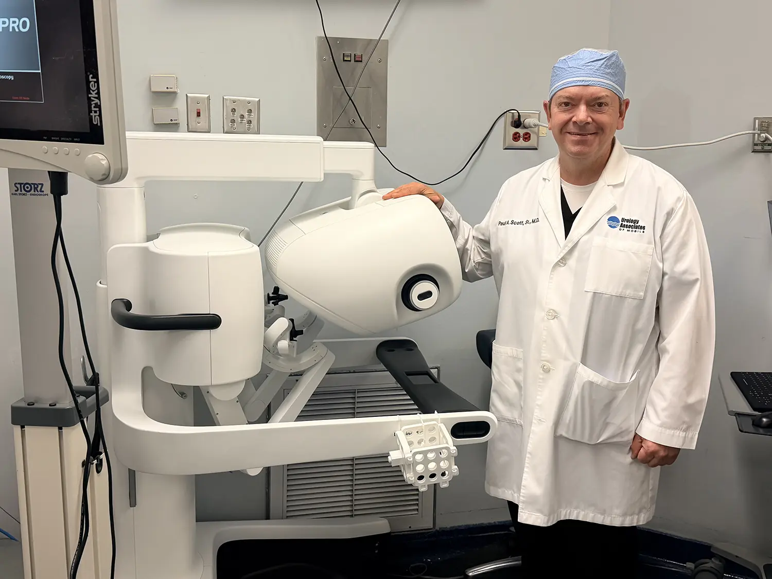 Dr. Paul Scott with robotic surgery equipment
