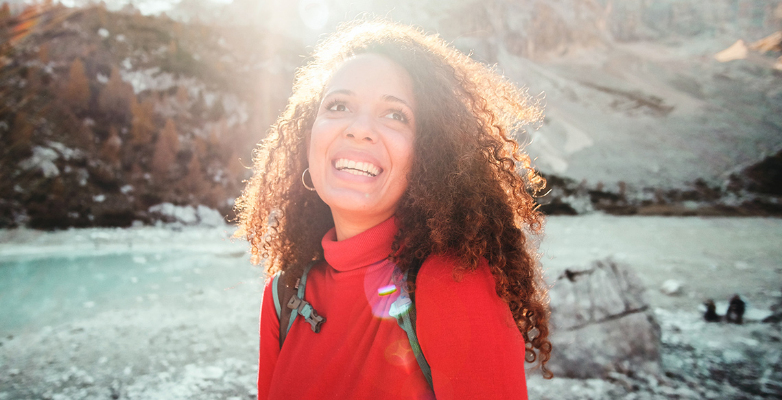 Smiling woman in sunshine